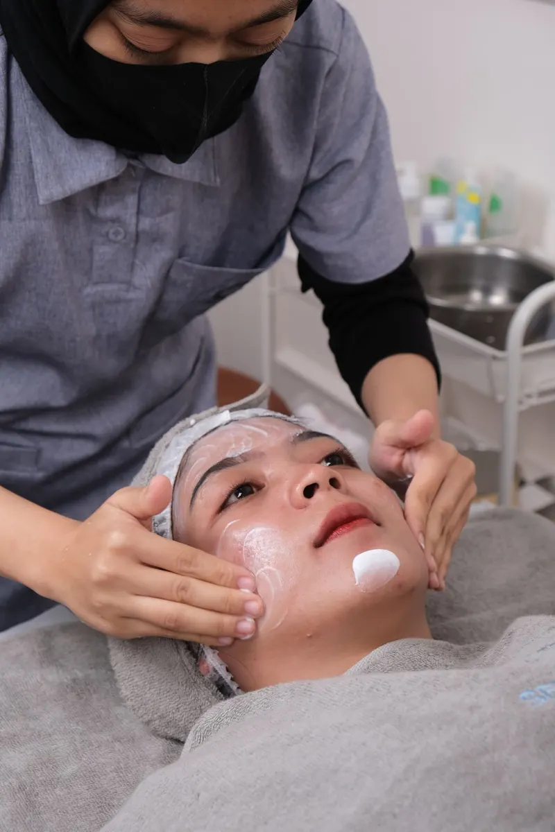 Illustrative photo: a facial cleanse in a treatment room